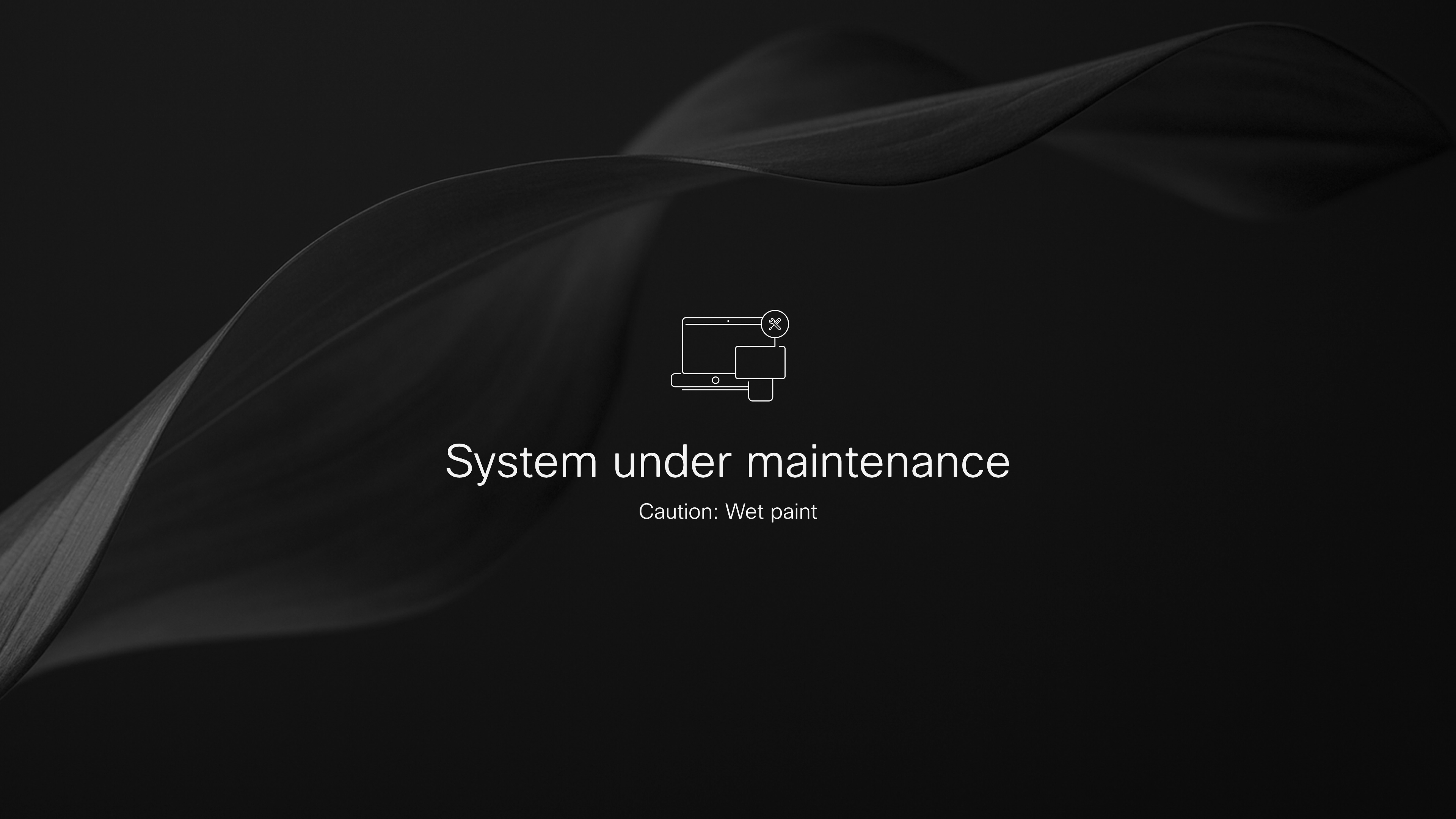 Device homescreen with a black wallpaper and the message "System under maintenance Caution: Wet paint"