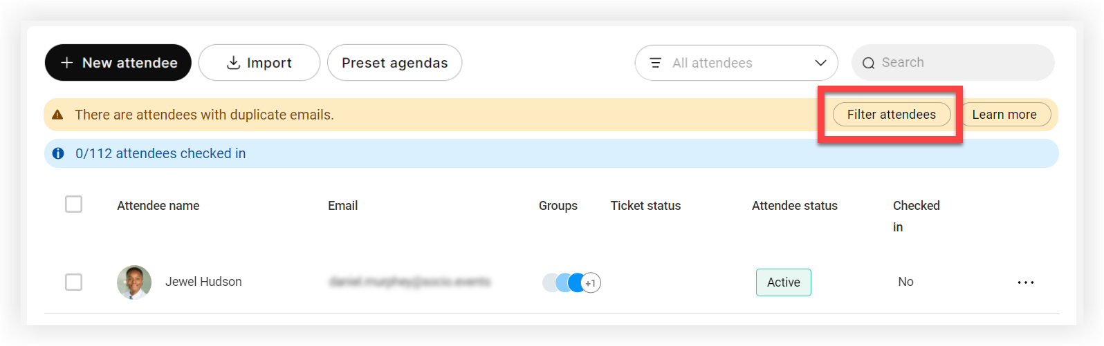 The duplicate email warning banner's 'Show Duplicates' button on the Attendees page.